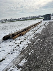 A photo of the donated power poles.