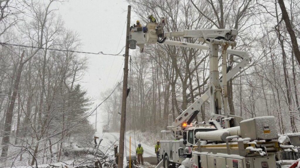 A photo of line crews working in winter weather that moved in on March 17.