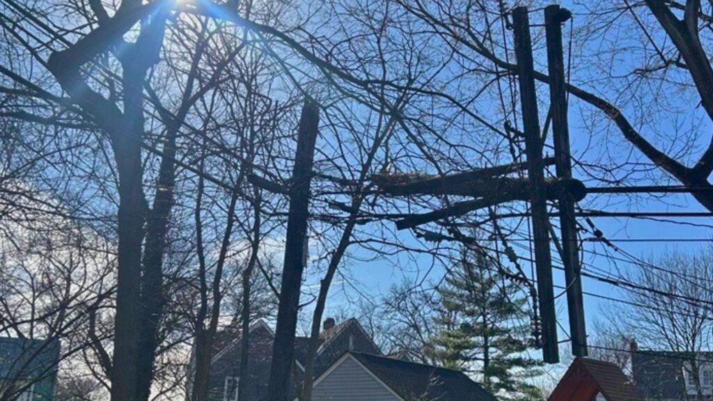 A photo of a broken power pole.